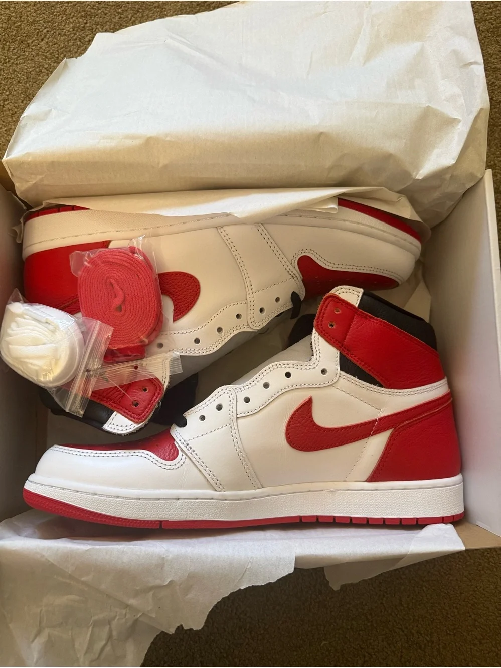 Jordan• 1 Retro High OG in White, University Red, Black